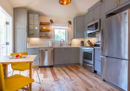 This custom residential design beach cottage kitchen with natural light in Santa Cruz designed by Golden Visions Design